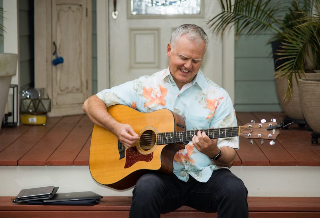 Ernie plays guitar